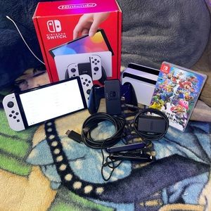 Its a good Nintendo switch oled comes with
everything you see in the pictures.